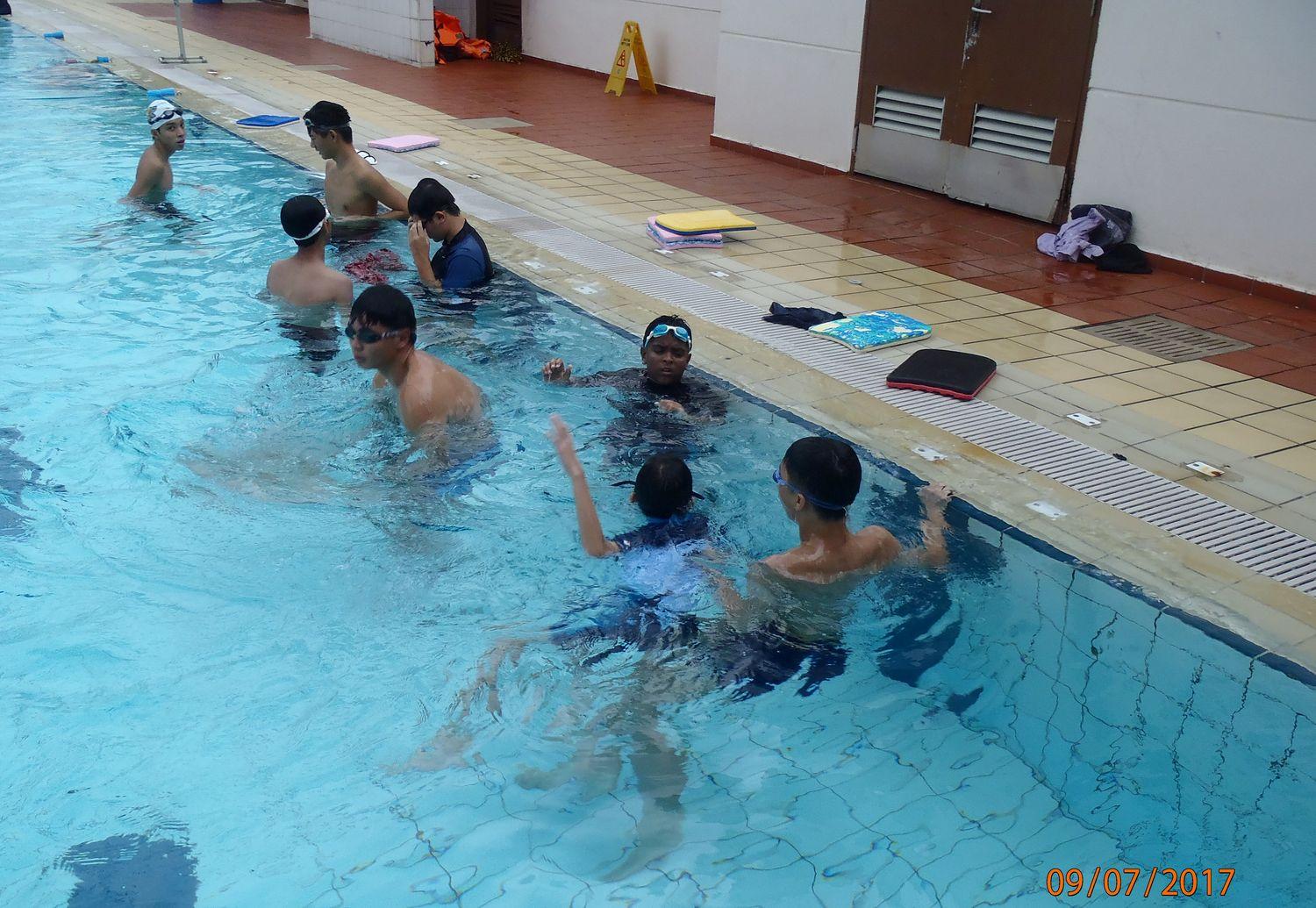 A group of swimmers during a lesson in the pool