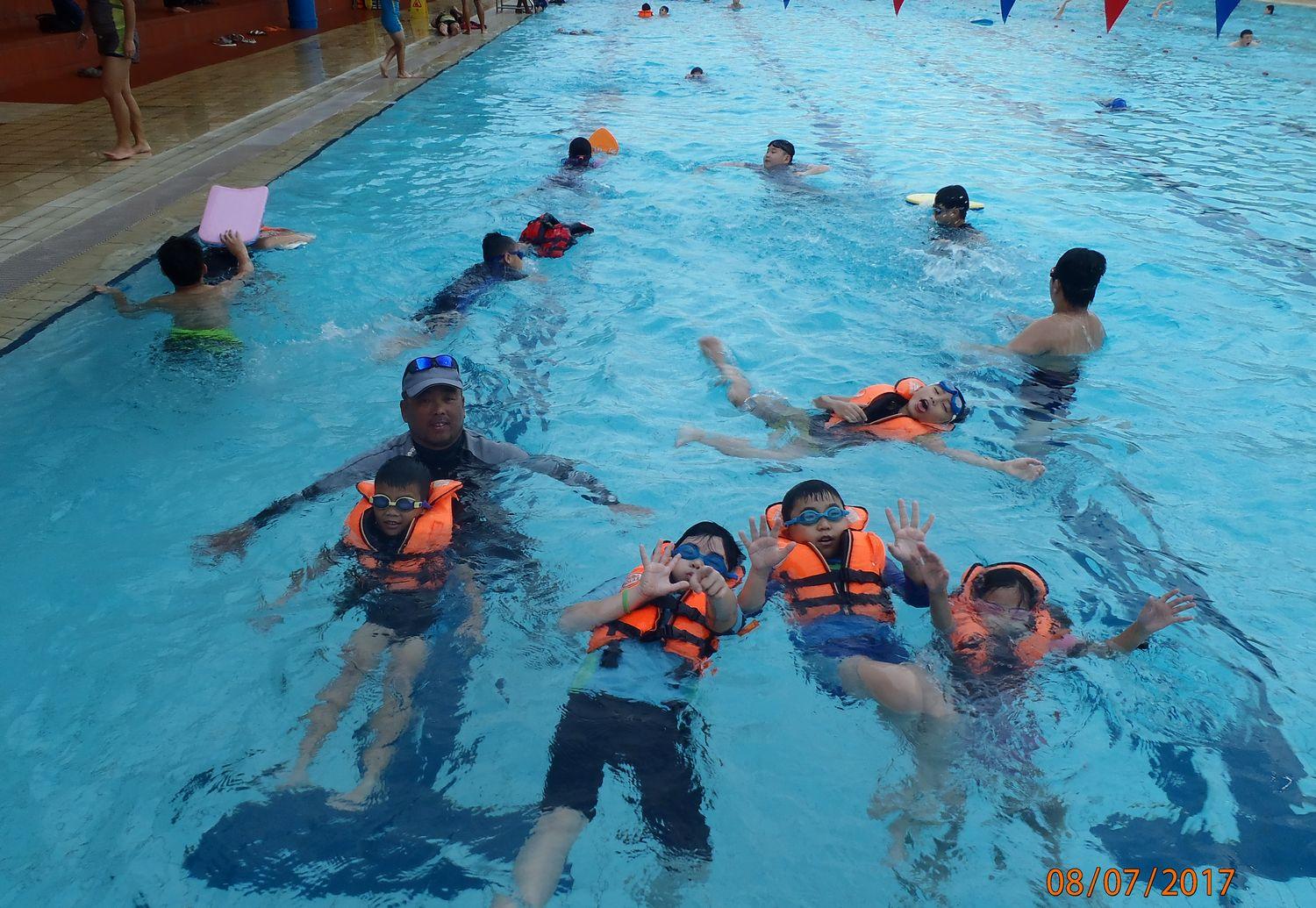 Swimmers doing laps across the pool